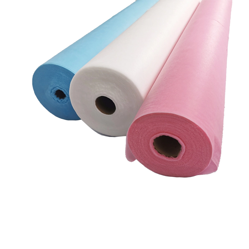Disposable non woven bed sheet roll with cross hole